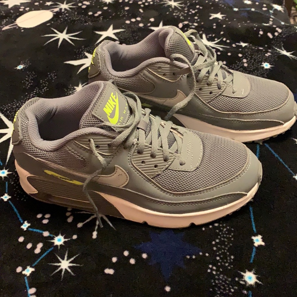 Gray Nike Air Max trimmed with lime green and white.